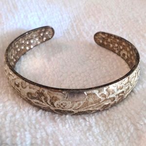 Metal floral stamped bangle